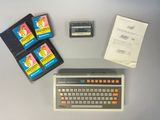a keyboard, cassette player, and other electronic equipment on a table