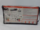 the box is open on a white surface with a red and black label