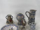 a lot of small vases and a bowl on the table