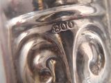 a close up of a silver object on a table