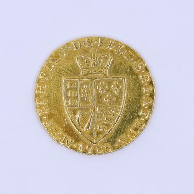 l'image d'une pièce d'or sur laquelle figurent des armoiries