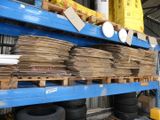 stacks of cardboards on a blue shelf in a warehouse