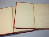 three open books sitting on top of a table next to each other