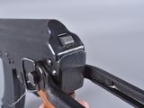 a person holding a machine gun in their hand