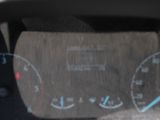 a close up of a car dashboard with a speedometer and gauges