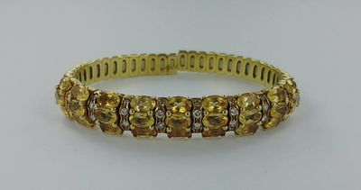 Bracelet ouvrant or serti de citrines et de diamants (enviro…
