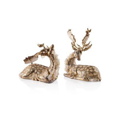 pair of silver deer figurines on a white background