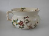 a white bowl with a floral design on it