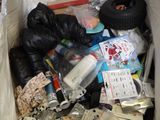 a box full of trash that is sitting on the floor