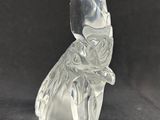 a glass figurine of a cat with a crown on it ' s head