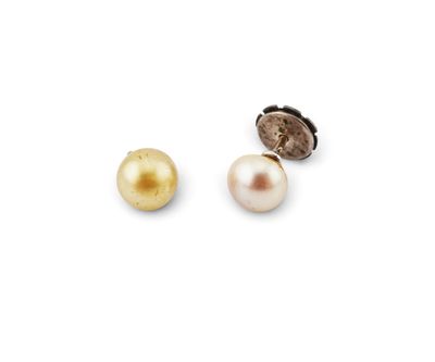 a pair of pearl and gold earrings on a white background