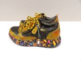 yellow and black sneakers with floral print on them on a white surface