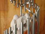 a metal rack that has a bunch of candles on it