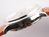 a close up of a watch with a brown strap