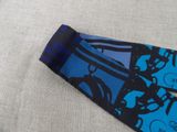 a tie that has a picture of a man on a bike on it