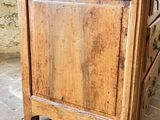 a small wooden cabinet with a drawer on top of it