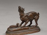 bronze statue of a dog with a ball in its mouth on a marble base