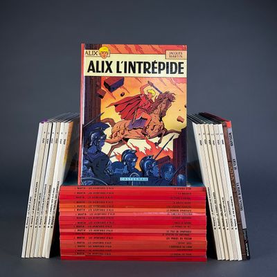 a stack of books with a picture of a man riding a horse