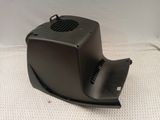a close up of a black speaker on a white surface