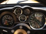 a close up of a car dashboard with gauges and speedometers