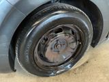 a close up of a tire on the side of a car