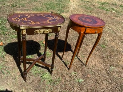 two tables that are sitting in the grass