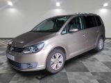 the silver van is parked on a checkered floor in the garage