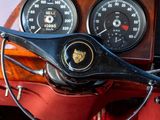 steering wheel and gauges of a classic car with a red cloth
