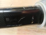 a close up of a microphone on a wooden table