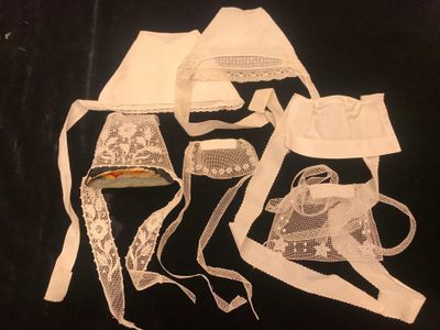 many different types of clothing on a black surface