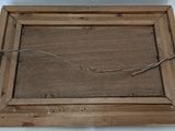 a picture of a piece of wood with barbed wire on it