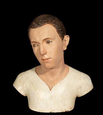 a bust of a man with a white shirt on