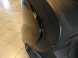 a black suitcase sitting on a tiled floor in a room