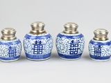 three blue and white vases with chinese writing on them