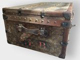 an old trunk that is sitting on the floor
