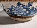 a blue and white bowl sitting on a table