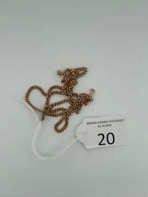 a close up of a tag with a chain attached to it