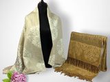 an image of a woman ' s shawl and a purse on a mannequin dummy