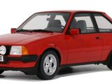 the red car is parked on a white surface with a white background