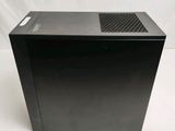 an image of a black desktop computer sitting on top of a white surface