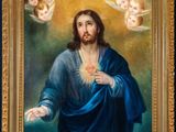 an oil painting of jesus holding a sacred heart surrounded by angels