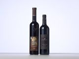 two bottles of wine sitting next to each other on a table