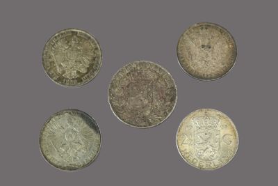 a group of five different british coins