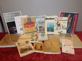several books on a red table with a red table cloth
