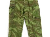 a close up of a green camouflage cargo pants on a white background