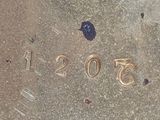 a close up of the numbers on the sidewalk