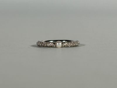 a close up of a ring on a table with a white background