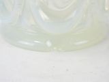 a glass vase with a swirly design on it