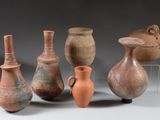 many different vases that are sitting on a table