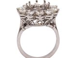 a close up of a diamond ring on a white background